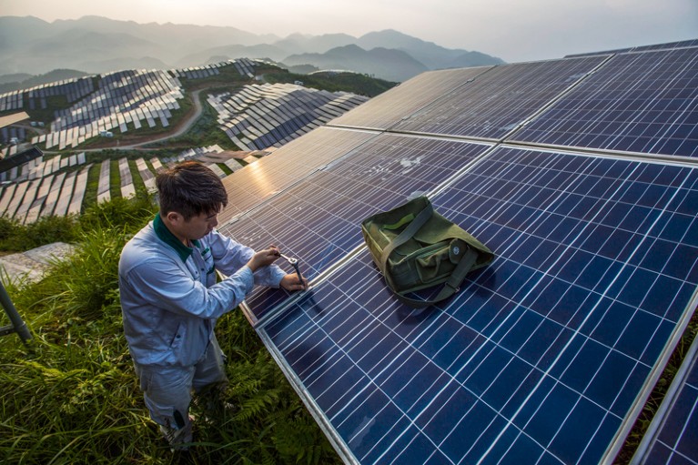 A worker works at Chinese photo-voltaic power station