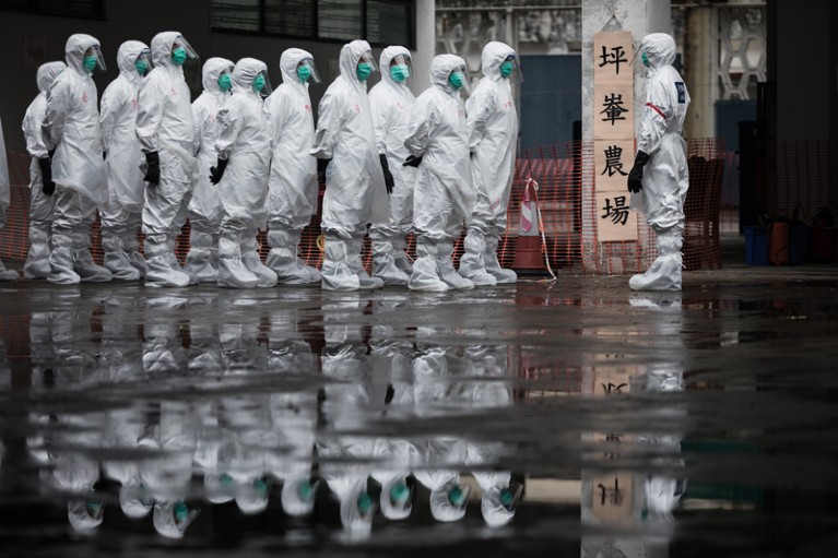 Volunteers wear protective clothing during an emergency response exercise in Hong Kong