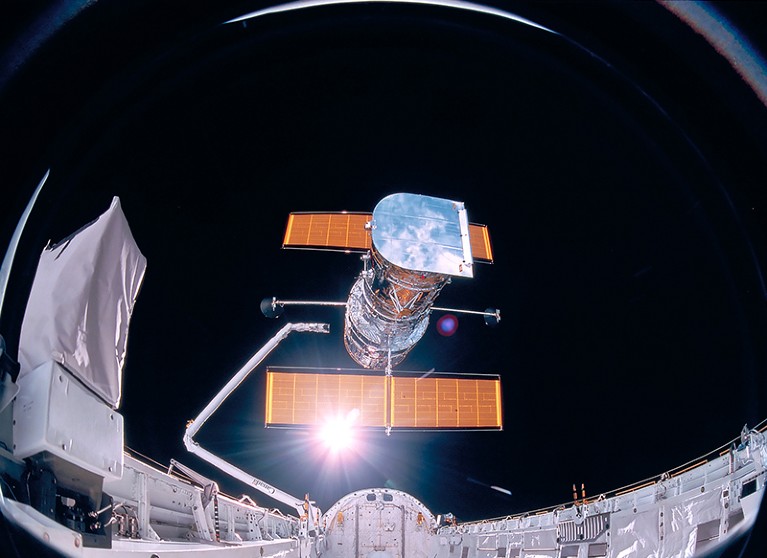 Hubble Space Telescope being deployed on April 25, 1990, from the payload bay of Space Shuttle Discovery