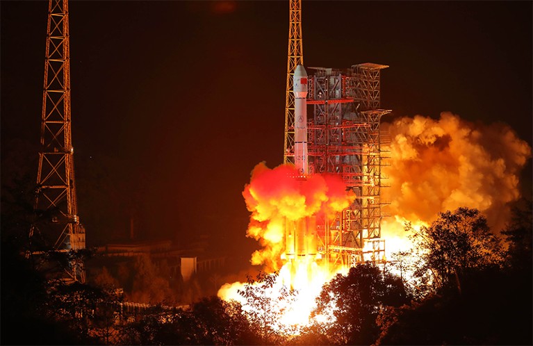 A Long March-3B rocket blasting off in the early morning darkness carrying China's CHang'e-4 lunar probe
