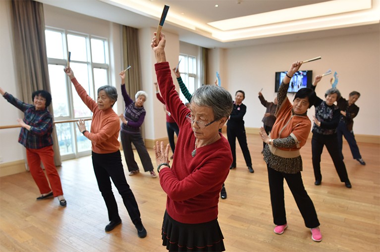 Residents of the Yanyuan community for senior citizens take a dance class