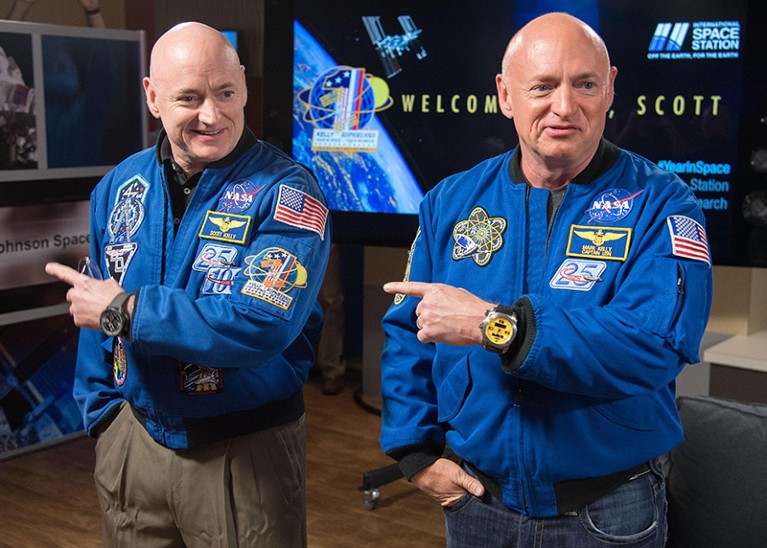 NASA astronauts Scott Kelly, left, with his twin brother, Mark Kelly