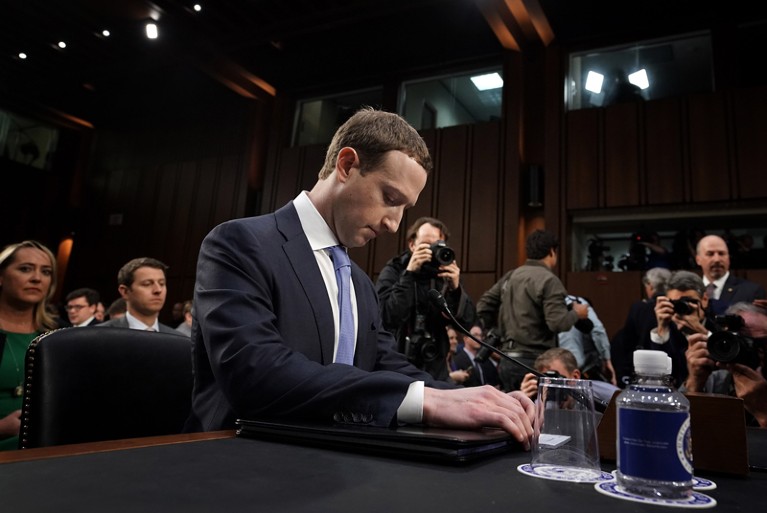 Mark Zuckerberg waits to testify before a combined Senate Judiciary and Commerce committee