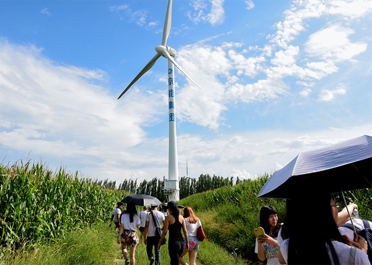 Photo of students visiting a Chinese wind farm