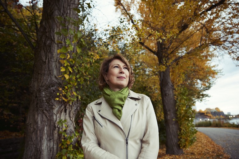 Mona Nemer walks on the path along the Ottawa River