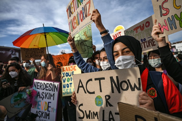 Participants hold signs during a Global Climate Strike in Istanbul