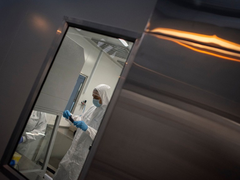 An employee at the Afrigen biotechnology company and Vaccine Hub facility works in the manufacturing laboratory in Cape Town.
