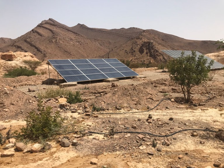 Solar panels are seen in a rocky desert terrain in Morocco