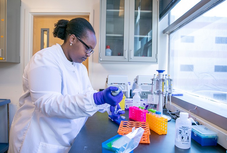 Kamariza uses a pipette in her laboratory