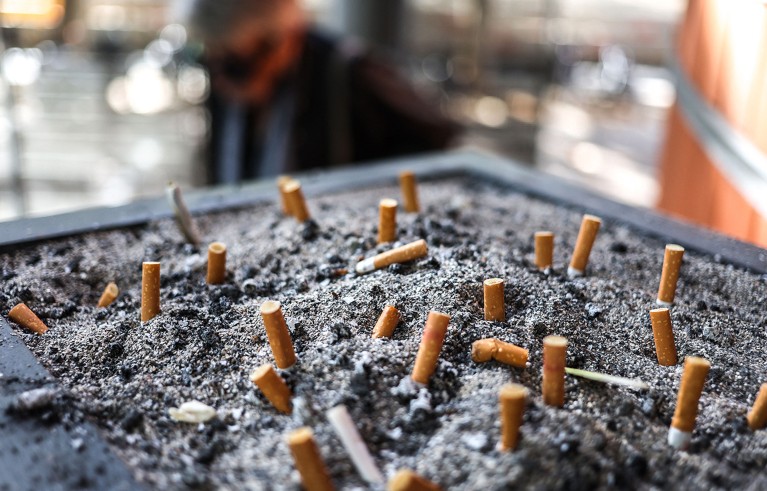 Cigarette butts in an ashtray in Toulouse, southwestern France