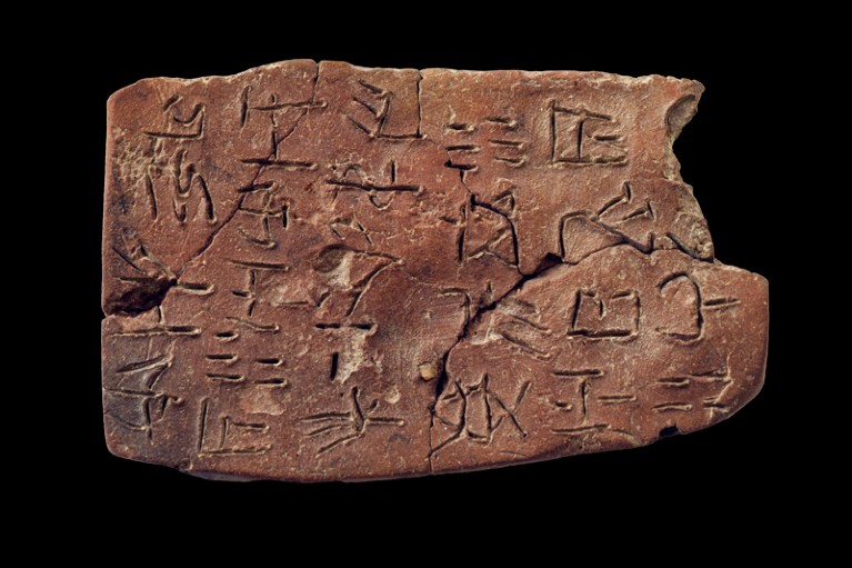 A piece of clay with Linear A writing engraved into the surface