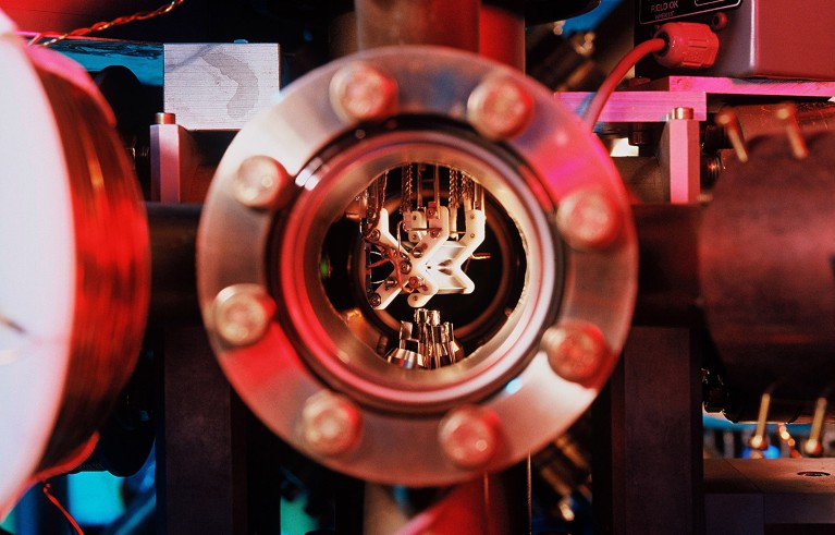 A view of the ion trap through a window in the vacuum chamber of the quantum computing device.