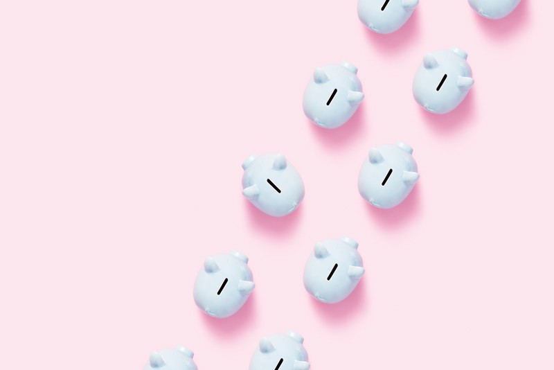 Piggy bank flat lay on pink background