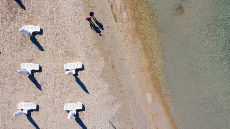 A drone photo shows an aerial view of sunbeds placed in accordance with the social distancing rules in Izmir, Turkey.