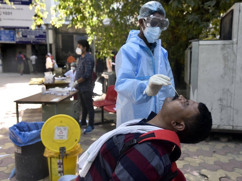 A health worker collected samples for coronavirus antigen testing, in New Delhi, India.