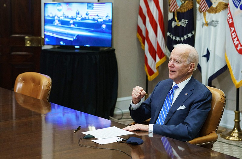 US President Joe Biden gestures as he speaks during a virtual call to congratulate the NASA JPL Perseverance team