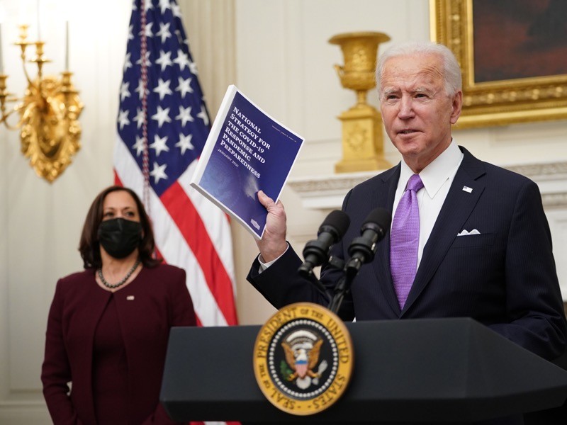 US President Joe Biden speaks about the Covid-19 response as US Vice President Kamala Harris looks.
