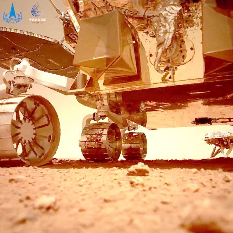 "Zhu Rong" rover detail, and lander in the far background.