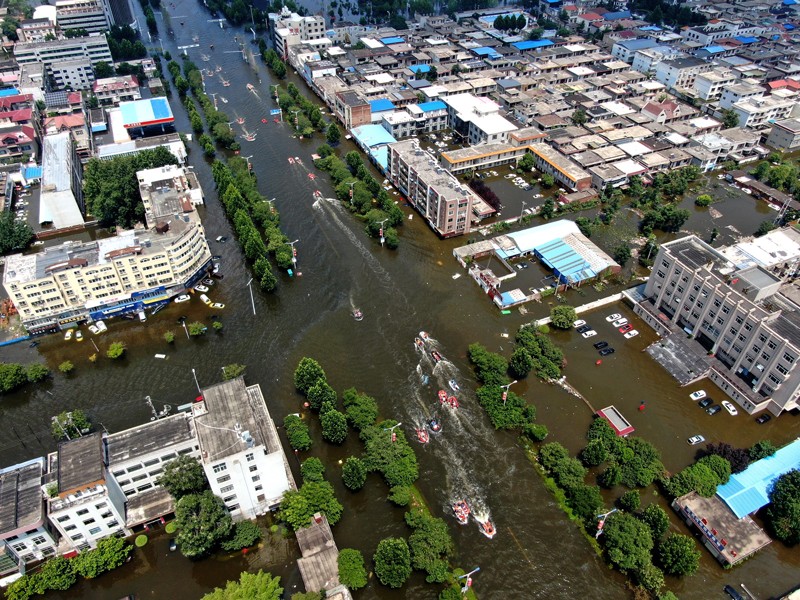 Figure 1: Drone view of rescuers transferring citizens out of the flooded zone in Weihui city