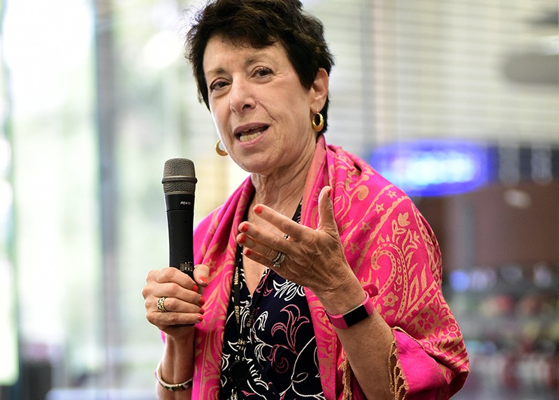 Linda Birnbaum speaking with a microphone at an event.