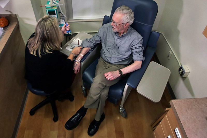 Charles Flagg, who has Alzheimer's disease, receives an infusion.