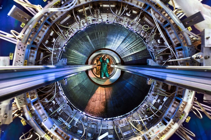 An engineer works in the open ALICE Inner Tracking System detector at the Large Hadron Collider at CERN