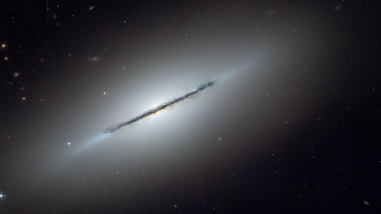 Lenticular galaxies such as NGC 5866, seen here, can be formed by massive galactic mergers.