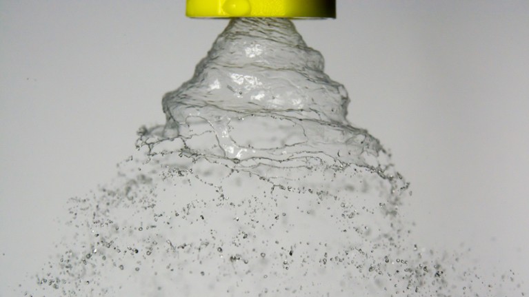 Fluid spray from a conical nozzle