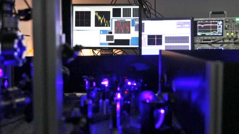 View of the clocks (purple foreground) with screens showing sub-programmes that control various parts of the clocks (background)