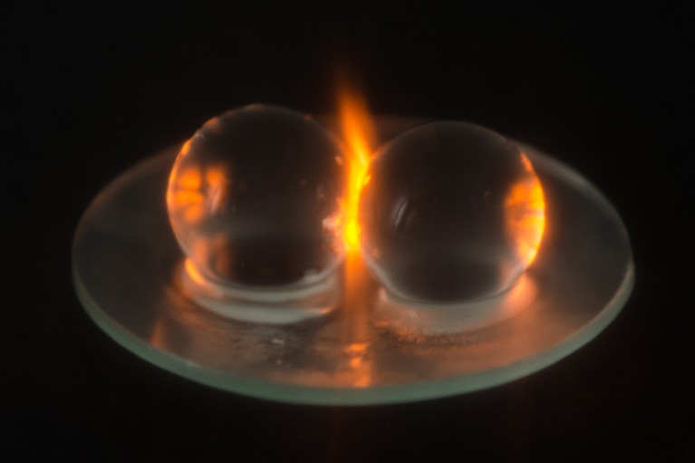 The plasma formed between two hydrogel beads glows as they are irradiated in a microwave oven.