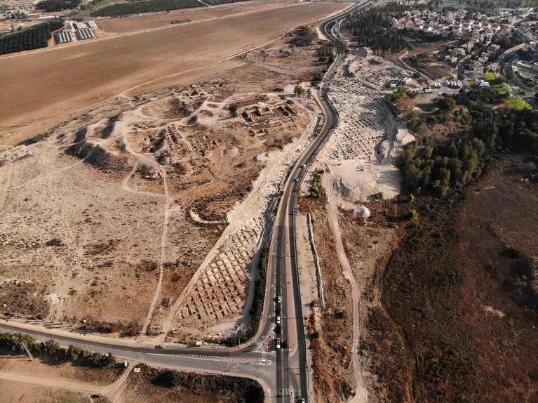 Aerial view of a main road running through an archaeological excavation site in Israel