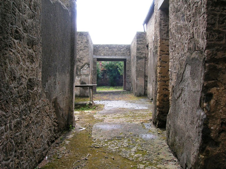 The stone walls and interior of Casa del Fabbro, Pompeii, Italy.