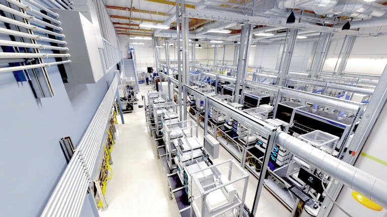View of a large room filled with automated lab machinery that can be programmed to run experiments at the