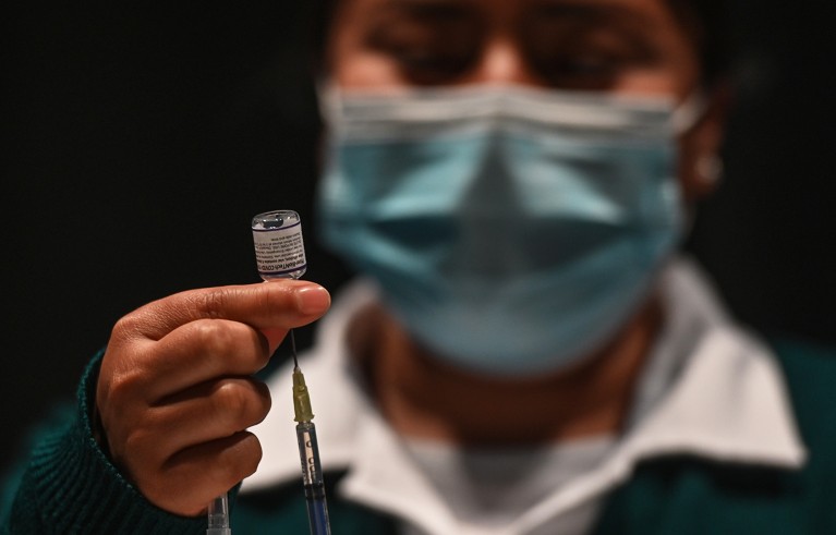 A nurse prepares the Pfizer-BioNTech COVID-19 vaccine for use at a vaccination centre, Mexico.