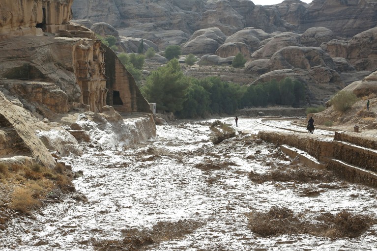 Water flows through a ravine in Petra.