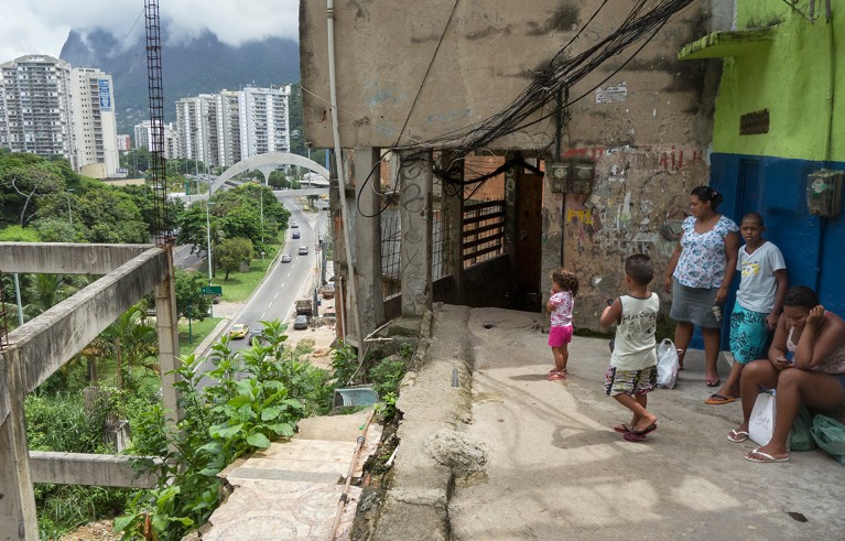 Poor people looking at the high-rise rich condos of Leblon from Rocinha, the largest Favela or urbanized slum in Brazil.