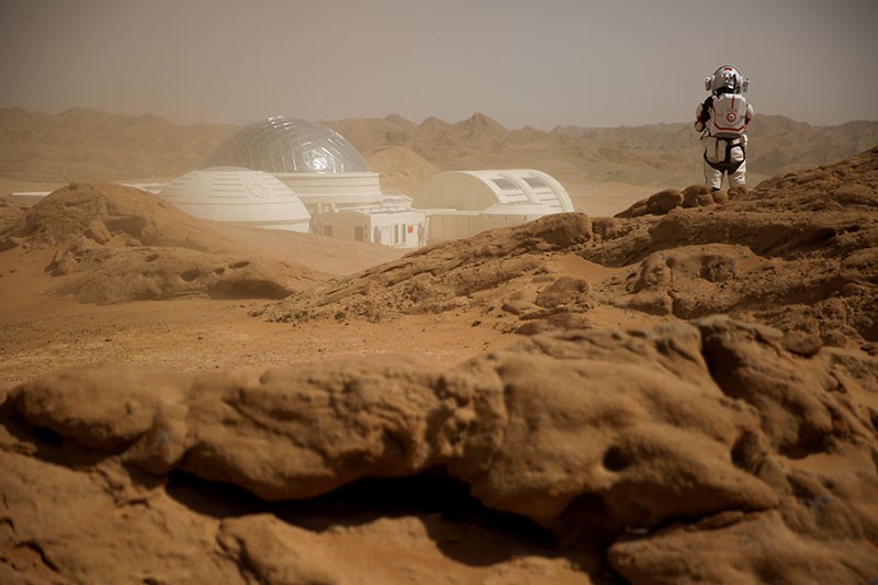 A person in space suit at the Mars simulation base of the C-Space project.