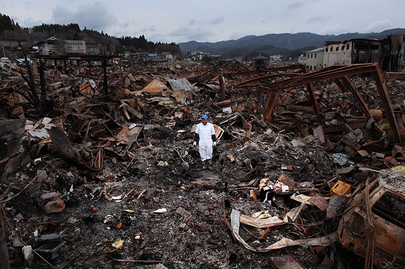 Sigo Hatareyama is working to clean up what's left of his house on March 21, 2011 in Kesennuma, Japan.