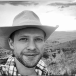 black and white headshot of James Hassell