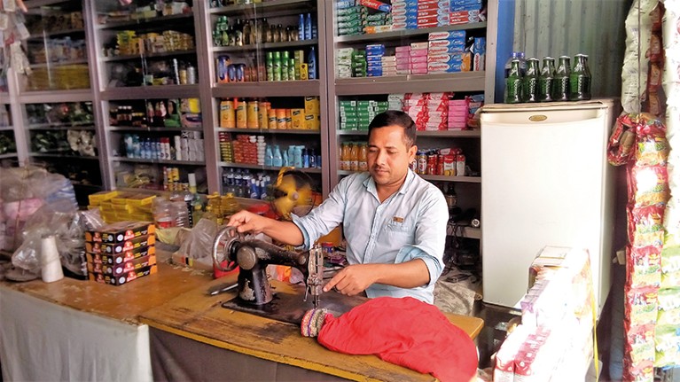 Man in shop on Sandwip Island, Bangladesh