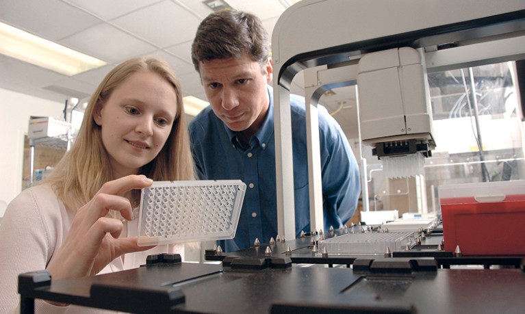 Michael White and Angelique Whitehurst in a lab