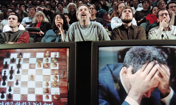 Chess grandmaster Garry Kasparov holds his head in his hands during his final game against computer program Deep Blue in 1997.