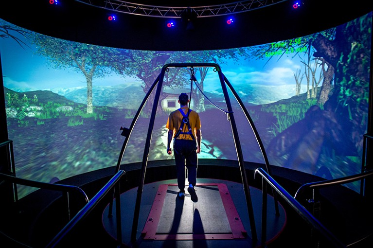 A traumatic brain injury patient walks through a virtual reality scenario.