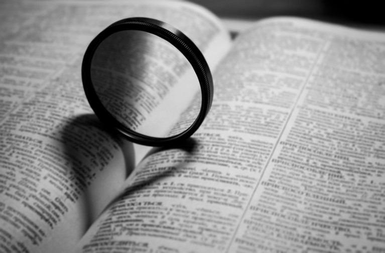 A magnifying glass on book