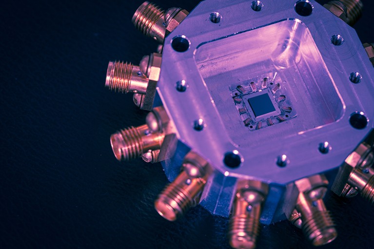 A false colour quantum computer chip on a dark background.