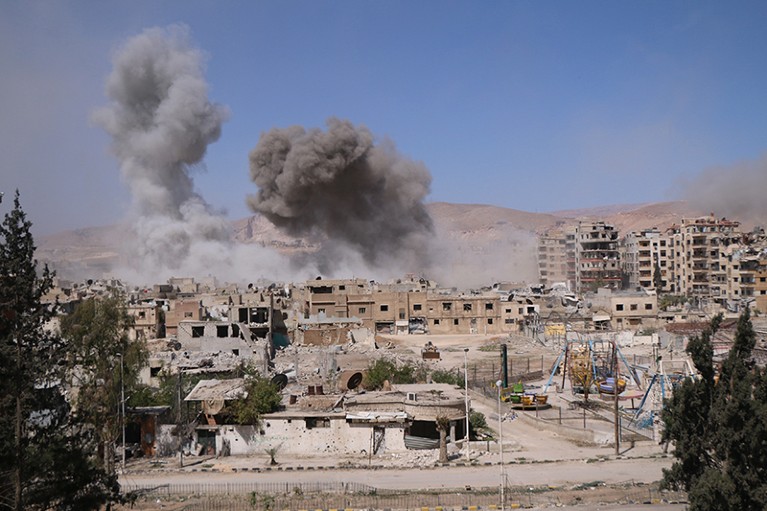 Smoke rises after Assad Regime forces carried out airstrikes in Eastern Ghouta's Douma town in Damascus, Syria on April 07, 2018