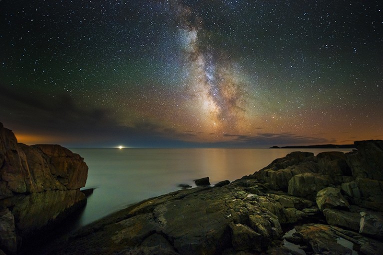 Starry sky over water in Maine