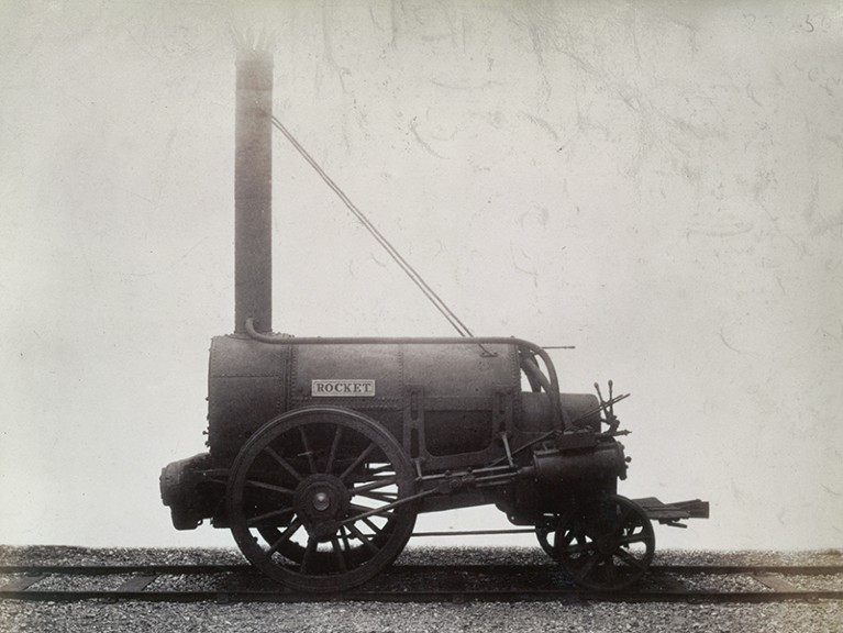 Black and white photograph of an early steam engine, Stephenson's 'Rocket', c1905.