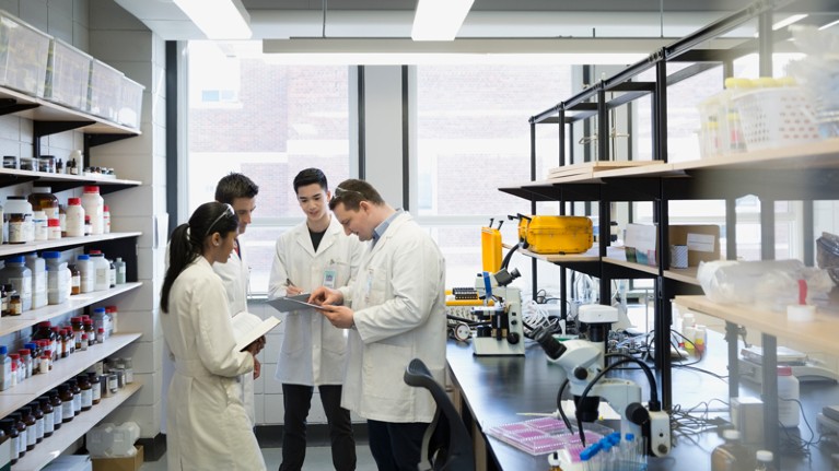 Scientists meeting in a laboratory