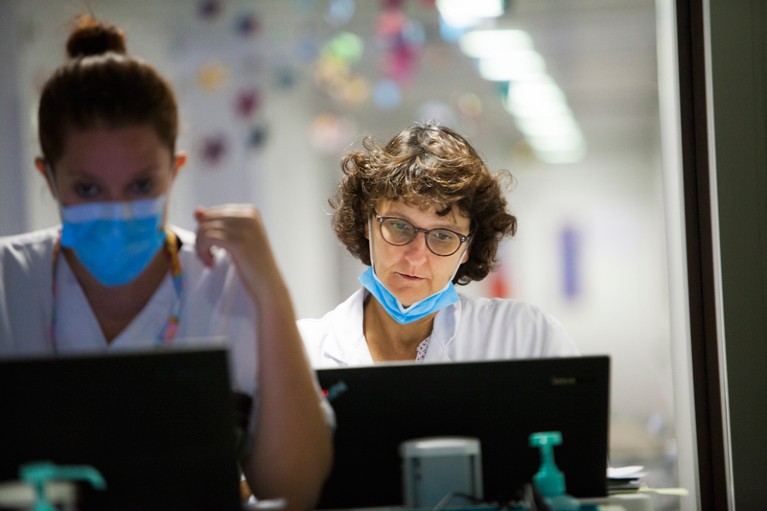 Doctors look at hospital computers